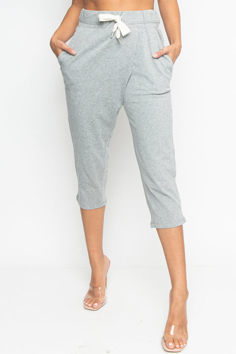 Cropped Sweat Pants with Asymmetrical Seam, Tummy Control Elastic Waistband and Front & Back Cargo Pockets (HA53365) - Wholesale Fashion Couture 