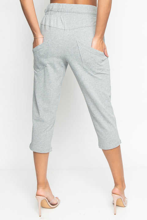 Cropped Sweat Pants with Asymmetrical Seam, Tummy Control Elastic Waistband and Front & Back Cargo Pockets (HA53365) - Wholesale Fashion Couture 